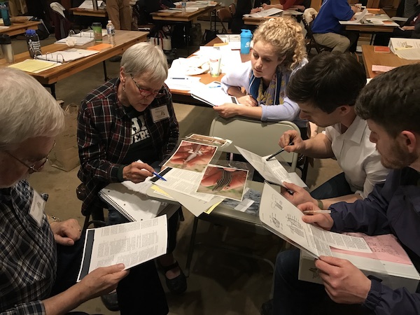 group of five people working together using photos and identification keys