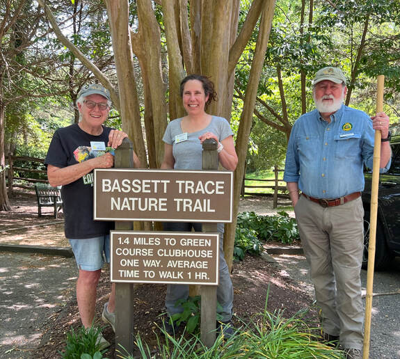 Historic Rivers Master Naturalist volunteers Judy Jones (left) and Rick Brown (right) with Virginia Master Naturalist Program Director Michelle Prysby (center) at the start of the Bassett Trace Nature Trail. Photo by Janet Harper.