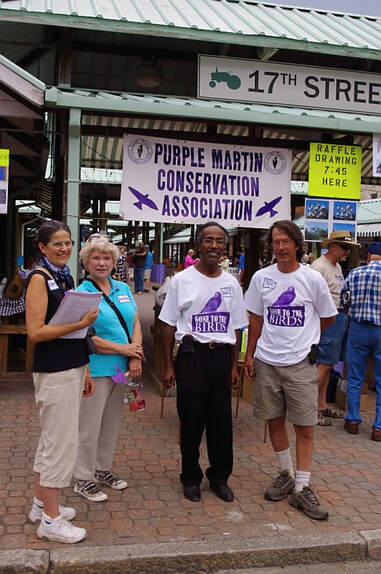 group photo on an urban street with banner reading