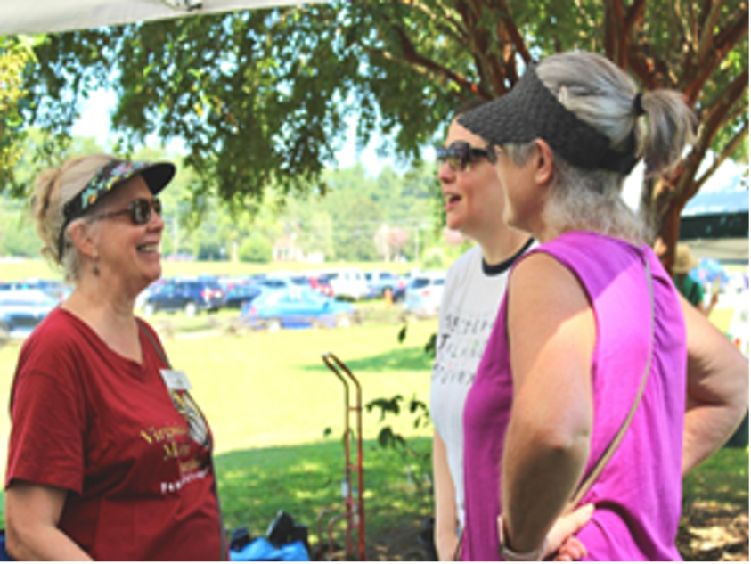 groups of three women talking together